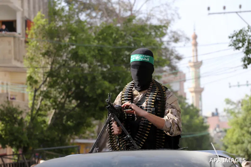 Palestinian members of the Ezzedine al-Qassam Brigades, the armed wing of the Hamas movement take part in the funeral of their comrade Abdel Salam Al-Batniji, 36, in Gaza city, on March 14, 2016. A Gaza tunnel collapsed...