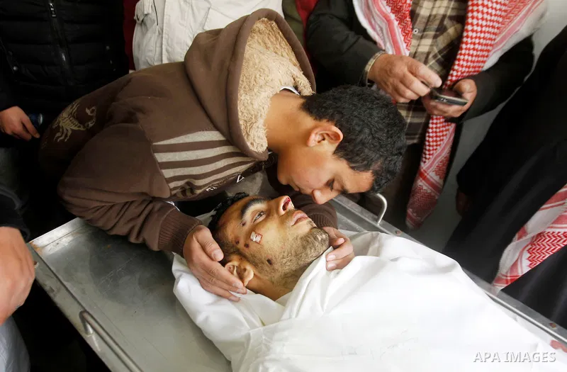 Relatives of Amir Juneidi, a Palestinian who was shot dead following reported attacks on Israelis, mourn during his funeral on March 15, 2016 in the West Bank town of Hebron. Three Palestinians, Qassem Jaber, 30, and Ami...