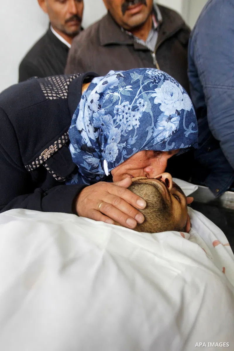 The mother of Qassem Jaber, a Palestinian who was shot dead following reported attacks on Israelis, mourns during his funeral on March 15, 2016 in the West Bank town of Hebron. Three Palestinians, Qassem Jaber, 30, and A...