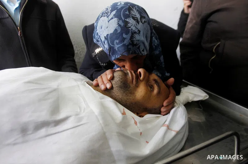 The mother of Qassem Jaber, a Palestinian who was shot dead following reported attacks on Israelis, mourns during his funeral on March 15, 2016 in the West Bank town of Hebron. Three Palestinians, Qassem Jaber, 30, and A...