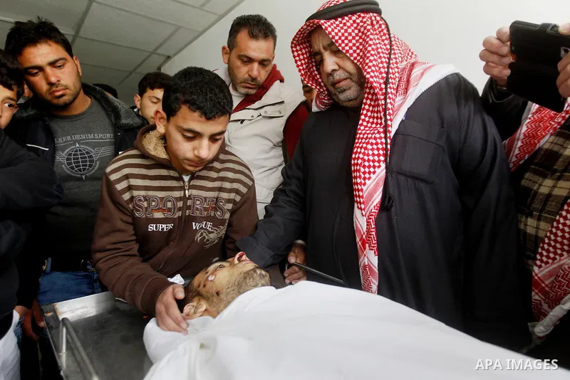 Relatives of Amir Juneidi, a Palestinian who was shot dead following reported attacks on Israelis, mourn during his funeral on March 15, 2016 in the West Bank town of Hebron. Three Palestinians, Qassem Jaber, 30, and Ami...