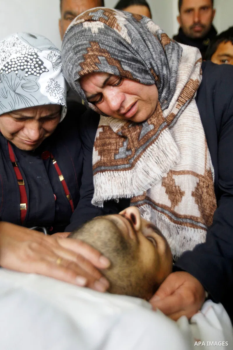 The sister of Qassem Jaber, a Palestinian who was shot dead following reported attacks on Israelis, mourns during his funeral on March 15, 2016 in the West Bank town of Hebron. Three Palestinians, Qassem Jaber, 30, and A...