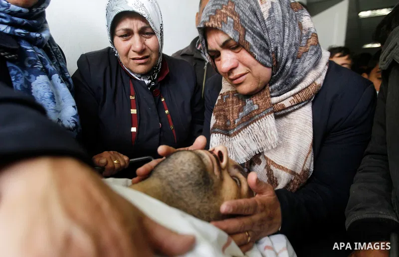 The sister of Qassem Jaber, a Palestinian who was shot dead following reported attacks on Israelis, mourns during his funeral on March 15, 2016 in the West Bank town of Hebron. Three Palestinians, Qassem Jaber, 30, and A...