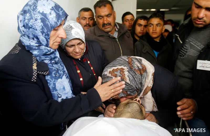 The sister of Qassem Jaber, a Palestinian who was shot dead following reported attacks on Israelis, mourns during his funeral on March 15, 2016 in the West Bank town of Hebron. Three Palestinians, Qassem Jaber, 30, and A...