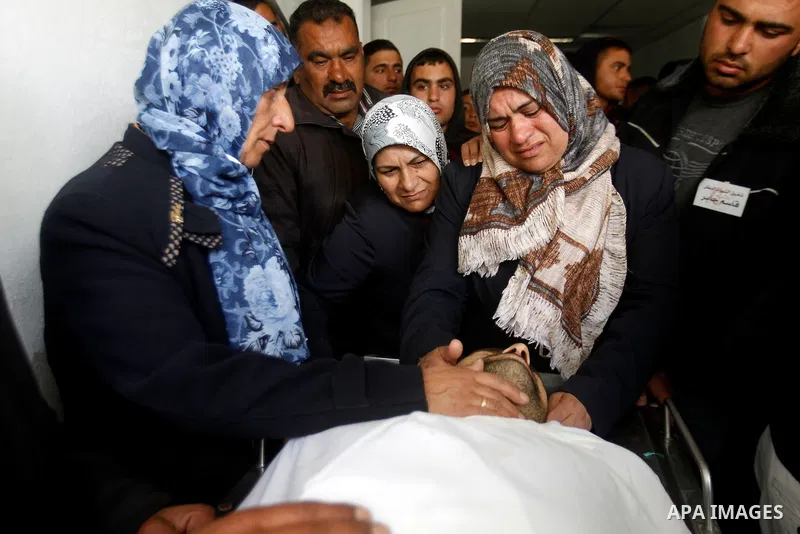 The sister of Qassem Jaber, a Palestinian who was shot dead following reported attacks on Israelis, mourns during his funeral on March 15, 2016 in the West Bank town of Hebron. Three Palestinians, Qassem Jaber, 30, and A...