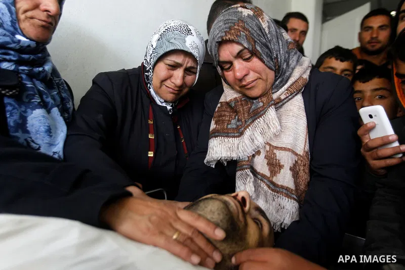 The sister of Qassem Jaber, a Palestinian who was shot dead following reported attacks on Israelis, mourns during his funeral on March 15, 2016 in the West Bank town of Hebron. Three Palestinians, Qassem Jaber, 30, and A...
