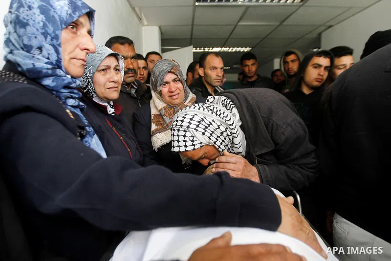 Relatives of Qassem Jaber, a Palestinian who was shot dead following reported attacks on Israelis, mourn during his funeral on March 15, 2016 in the West Bank town of Hebron. Three Palestinians, Qassem Jaber, 30, and Ami...