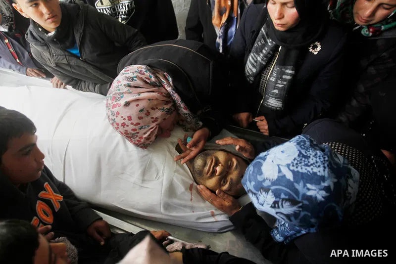 The sister of Qassem Jaber, a Palestinian who was shot dead following reported attacks on Israelis, mourns during his funeral on March 15, 2016 in the West Bank town of Hebron. Three Palestinians, Qassem Jaber, 30, and A...