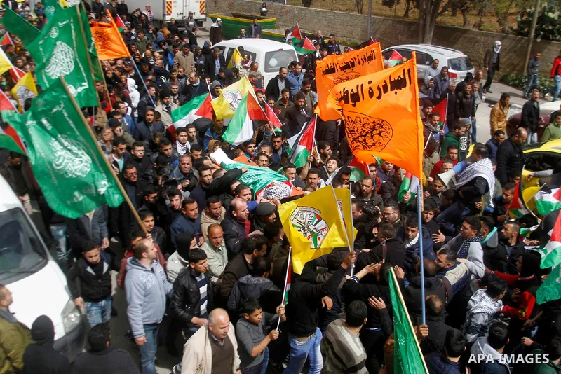 Mourners carry the body of Amir Juneidi, a Palestinian who was shot dead following reported attacks on Israelis, during his funeral on March 15, 2016 in the West Bank town of Hebron. Three Palestinians, Qassem Jaber, 30,...