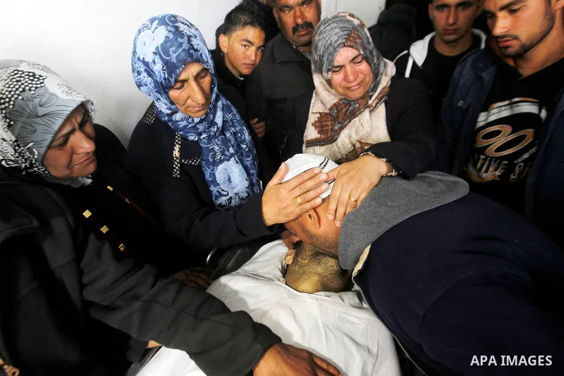 Relatives of Qassem Jaber, a Palestinian who was shot dead following reported attacks on Israelis, mourn during his funeral on March 15, 2016 in the West Bank town of Hebron. Three Palestinians, Qassem Jaber, 30, and Ami...