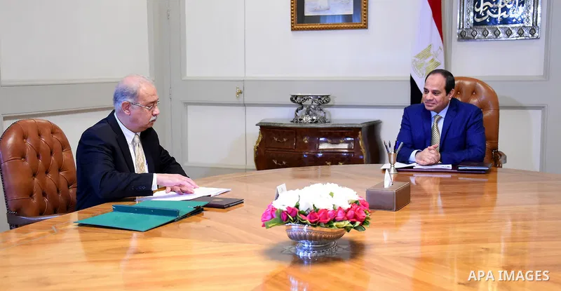 Egyptian President Abdel Fattah al-Sisi meets with Egyptian Prime Minister in Cairo, Egypt on March 15, 2016. Photo by Egyptian President Office