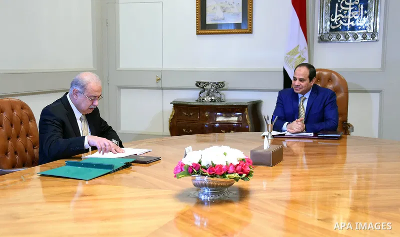 Egyptian President Abdel Fattah al-Sisi meets with Egyptian Prime Minister in Cairo, Egypt on March 15, 2016. Photo by Egyptian President Office