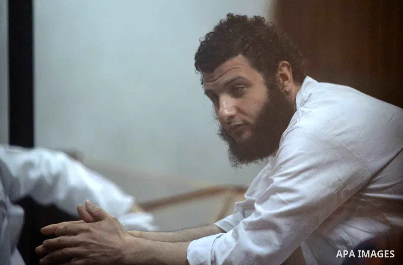 Defendants of Egyptian Muslim Brotherhood sit behind bars during the 'Qatar espionage' case, in a court in Cairo on March 15, 2016. The defendants are accused of 'leaking important national security documents and informa...
