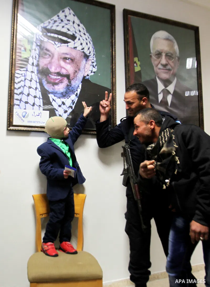 Five-year-old Ahmed Dawabsha, a Palestinian boy who survived a firebombing by Jewish extremists targeting his family home that killed his parents and brother, is seen before his meeting with the governor of the northern...