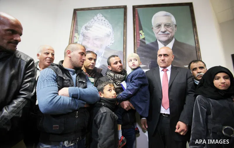 Five-year-old Ahmed Dawabsha, a Palestinian boy who survived a firebombing by Jewish extremists targeting his family home that killed his parents and brother, meets with the governor of the northern Palestinian town of N...