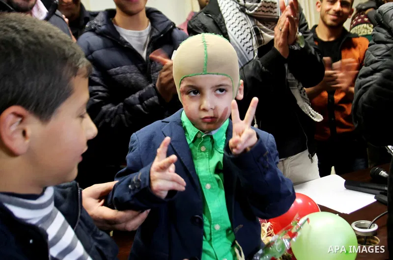 Five-year-old Ahmed Dawabsha, a Palestinian boy who survived a firebombing by Jewish extremists targeting his family home that killed his parents and brother, is seen before his meeting with the governor of the northern...
