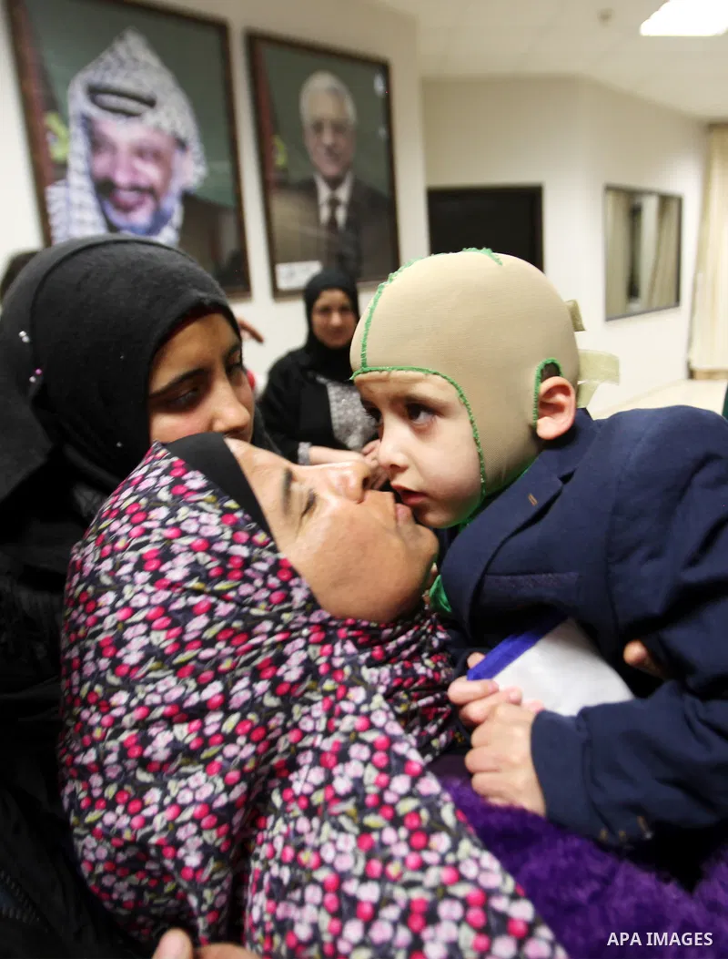 Five-year-old Ahmed Dawabsha, a Palestinian boy who survived a firebombing by Jewish extremists targeting his family home that killed his parents and brother, is seen before his meeting with the governor of the northern...