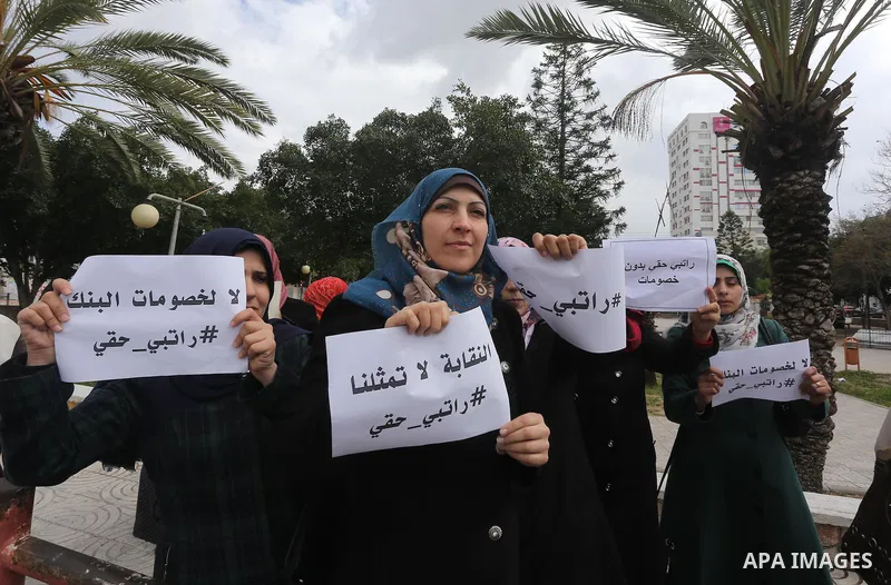 Employees of former Palestinian government take part in a protest to demand for pay their salaries, in Gaza city on March 16, 2016. Photo by Mohammed Asad