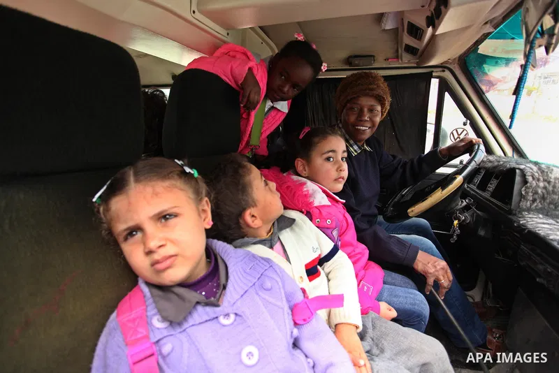 Salwa Sorour drives her mini-van in Gaza City on March 16, 2016. 40-year-old Salwa Sorour is the only woman who drives a kindergarten mini-van to transport children in the Gaza Strip. The Palestinian Central Bureau of St...