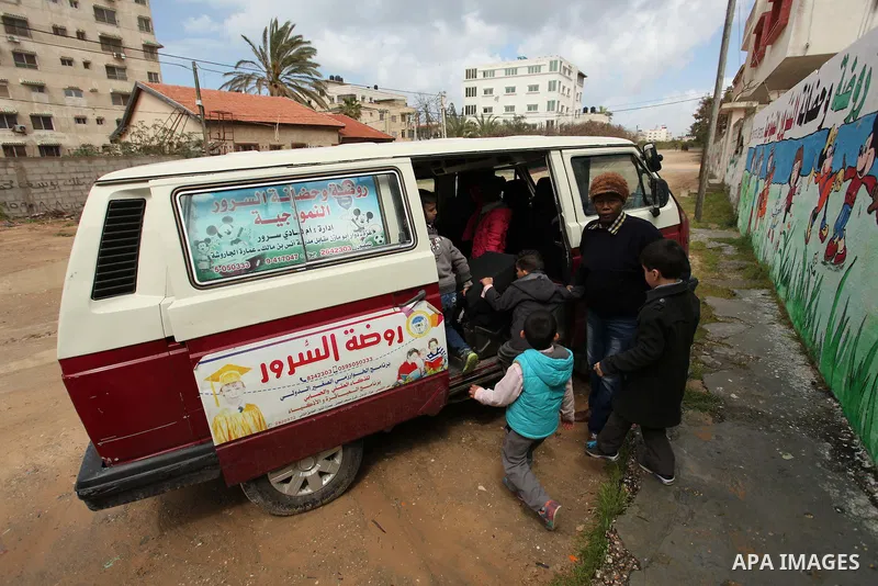 Salwa Sorour drives her mini-van in Gaza City on March 16, 2016. 40-year-old Salwa Sorour is the only woman who drives a kindergarten mini-van to transport children in the Gaza Strip. The Palestinian Central Bureau of St...