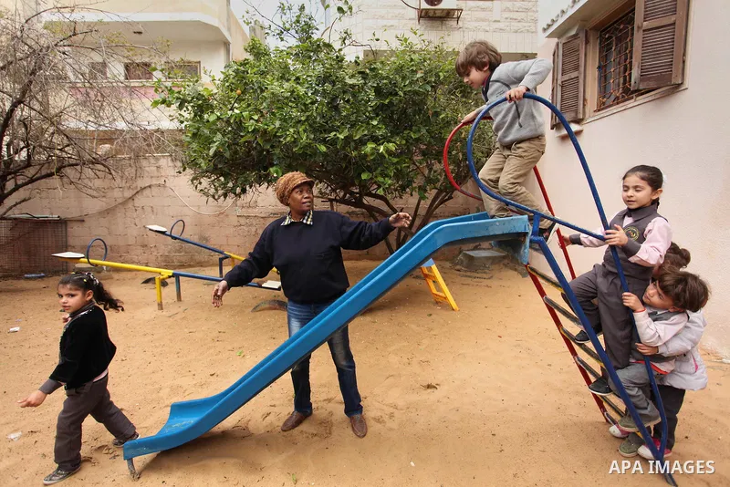 Salwa Sorour plays with children inside a kindergarten in Gaza City, on March 16, 2016. 40-year-old Salwa Sorour is the only woman who drives a kindergarten mini-van to transport children in the Gaza Strip. The Palestini...