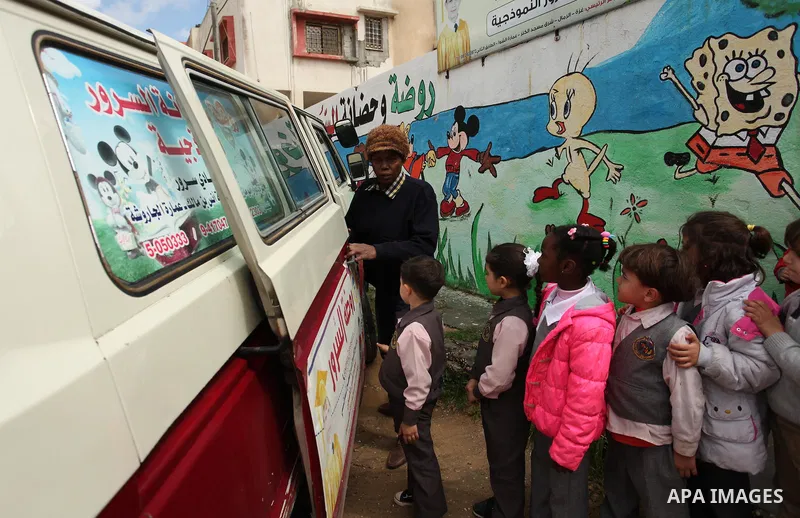 Salwa Sorour drives her mini-van in Gaza City on March 16, 2016. 40-year-old Salwa Sorour is the only woman who drives a kindergarten mini-van to transport children in the Gaza Strip. The Palestinian Central Bureau of St...