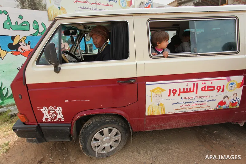 Salwa Sorour drives her mini-van in Gaza City on March 16, 2016. 40-year-old Salwa Sorour is the only woman who drives a kindergarten mini-van to transport children in the Gaza Strip. The Palestinian Central Bureau of St...