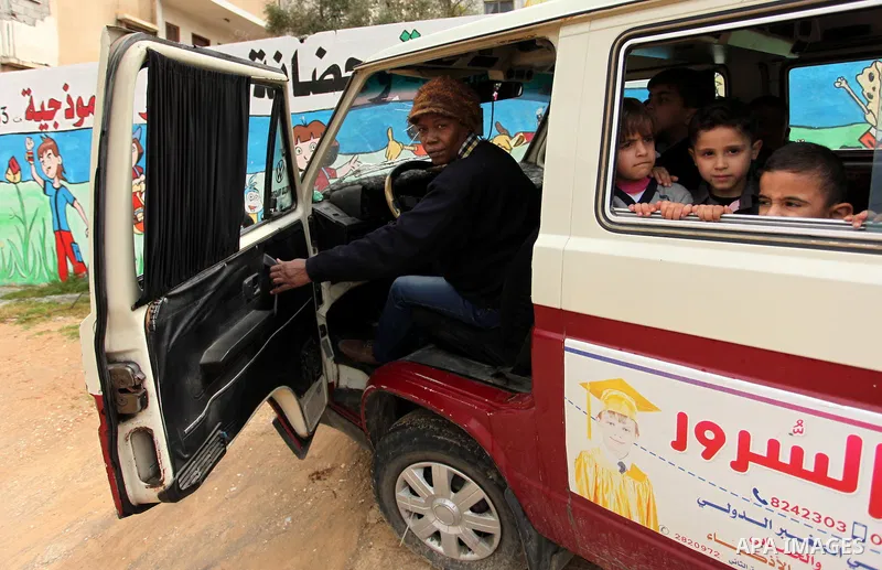 Salwa Sorour drives her mini-van in Gaza City on March 16, 2016. 40-year-old Salwa Sorour is the only woman who drives a kindergarten mini-van to transport children in the Gaza Strip. The Palestinian Central Bureau of St...
