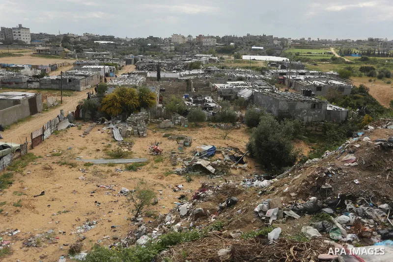 Dwellings stand in a slum area where Palestinian woman Jihan Abu Muhsen, who collects bricks for sale from sites of demolished buildings, lives, in Khan Younis in the southern Gaza Strip March 17, 2016. Abu Muhsen gather...