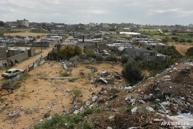 Dwellings stand in a slum area where Palestinian woman Jihan Abu Muhsen, who collects bricks for sale from sites of demolished buildings, lives, in Khan Younis in the southern Gaza Strip March 17, 2016. Abu Muhsen gather...