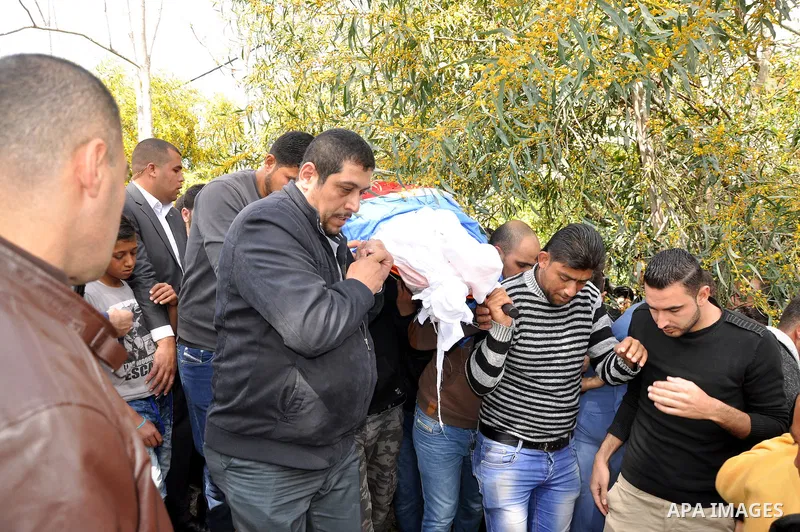 Palestinian Prime Minister Rami Hamdallah attends the funeral of 16 Palestinians, who lost their lives in overturned bus accident in Jordan on their way to Saudi Arabia for umrah in the West Bank village of Deir al-Ghoss...