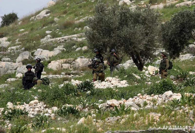 Israeli security forces take position during clashes with Palestinian protesters following a demonstration against the expropriation of Palestinian land by Israel in the village of Kfar Qaddum, near Nablus, in the occupi...