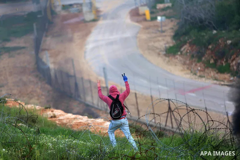 Palestinian protesters clash with Israeli security forces on March 18, 2016, following a demonstration in solidarity with Palestinian prisoners held in Israeli jails, outside the compound of the Israeli-run Ofer prison n...