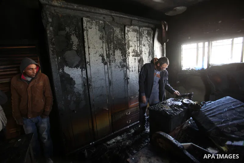Palestinians inspect the damage to the torched house of Ibrahim Dawabsheh, the main witness in the July arson attack that killed a Palestinian family, in the Israeli occupied West Bank village of Duma near Nablus , after...