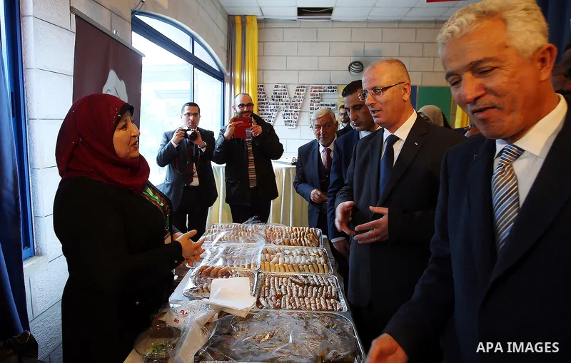 Palestinian Prime Minister Rami Hamdallah attends the opening of Palestinian food exhibition in the West Bank city of Ramallah on March 20, 2016. Photo by Prime Minister Office
