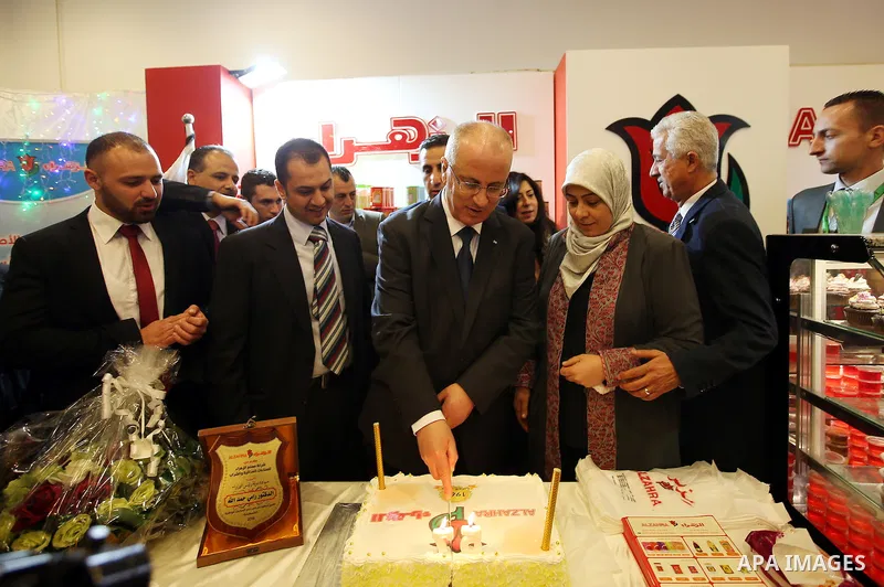 Palestinian Prime Minister Rami Hamdallah attends the opening of Palestinian food exhibition in the West Bank city of Ramallah on March 20, 2016. Photo by Prime Minister Office
