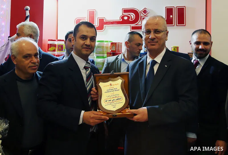 Palestinian Prime Minister Rami Hamdallah attends the opening of Palestinian food exhibition in the West Bank city of Ramallah on March 20, 2016. Photo by Prime Minister Office