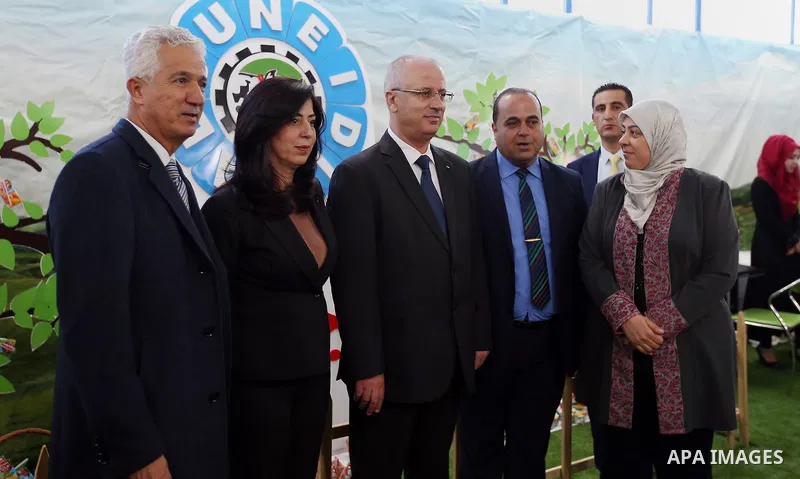 Palestinian Prime Minister Rami Hamdallah attends the opening of Palestinian food exhibition in the West Bank city of Ramallah on March 20, 2016. Photo by Prime Minister Office