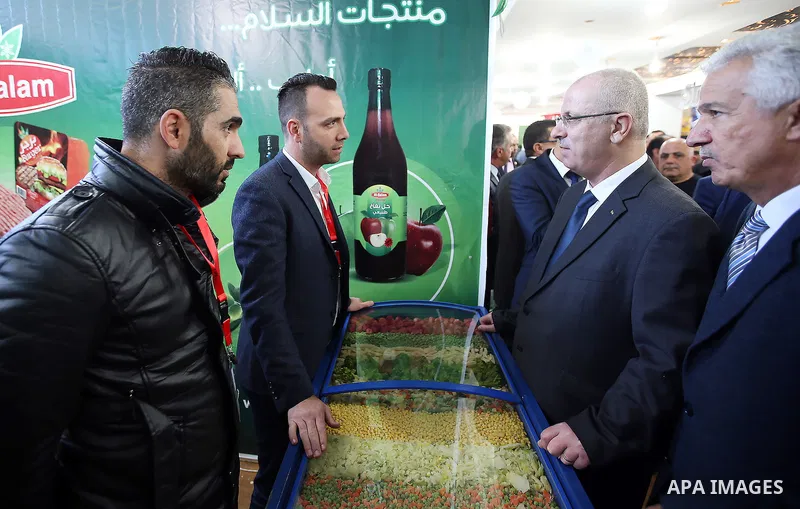 Palestinian Prime Minister Rami Hamdallah attends the opening of Palestinian food exhibition in the West Bank city of Ramallah on March 20, 2016. Photo by Prime Minister Office