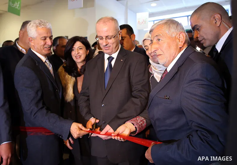 Palestinian Prime Minister Rami Hamdallah attends the opening of Palestinian food exhibition in the West Bank city of Ramallah on March 20, 2016. Photo by Prime Minister Office