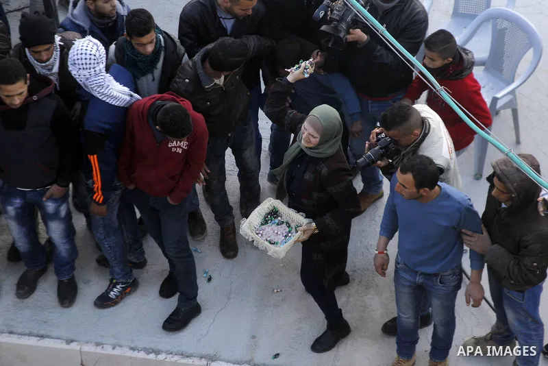 Mourners carry the body of Palestinian Ali Taqatqa, who the Israeli military said was shot dead with another Palestinian by Israeli troops after they stabbed and wounded an Israeli soldier on Thursday outside a Jewish se...