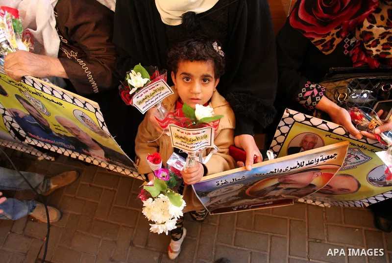 Palestinian women take part in a protest demanding release the prisoners in Israeli jails, in front of Red cross office, in Gaza city, on March 21, 2016. Photo by Ashraf Amra