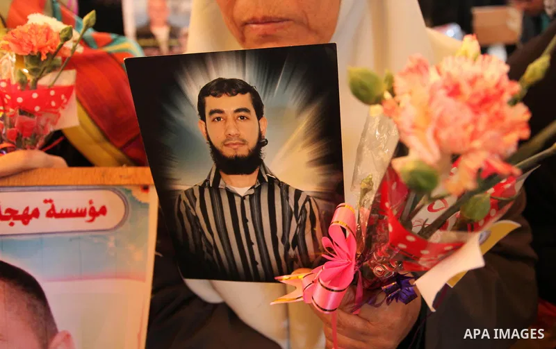 Palestinian women take part in a protest demanding release the prisoners in Israeli jails, in front of Red cross office, in Gaza city, on March 21, 2016. Photo by Ashraf Amra