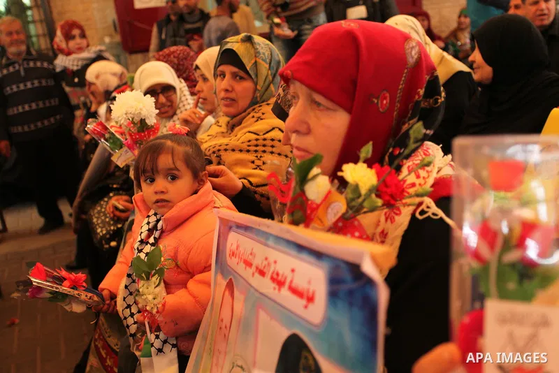 Palestinian women take part in a protest demanding release the prisoners in Israeli jails, in front of Red cross office, in Gaza city, on March 21, 2016. Photo by Ashraf Amra