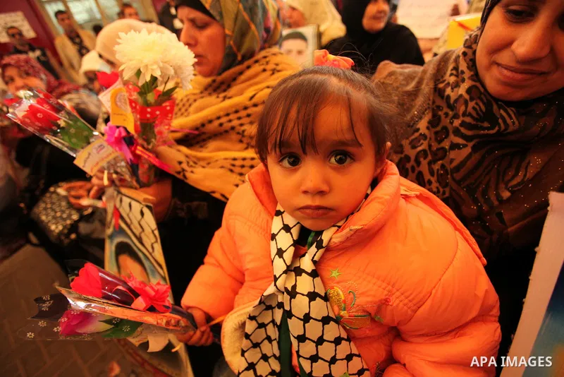 Palestinian women take part in a protest demanding release the prisoners in Israeli jails, in front of Red cross office, in Gaza city, on March 21, 2016. Photo by Ashraf Amra