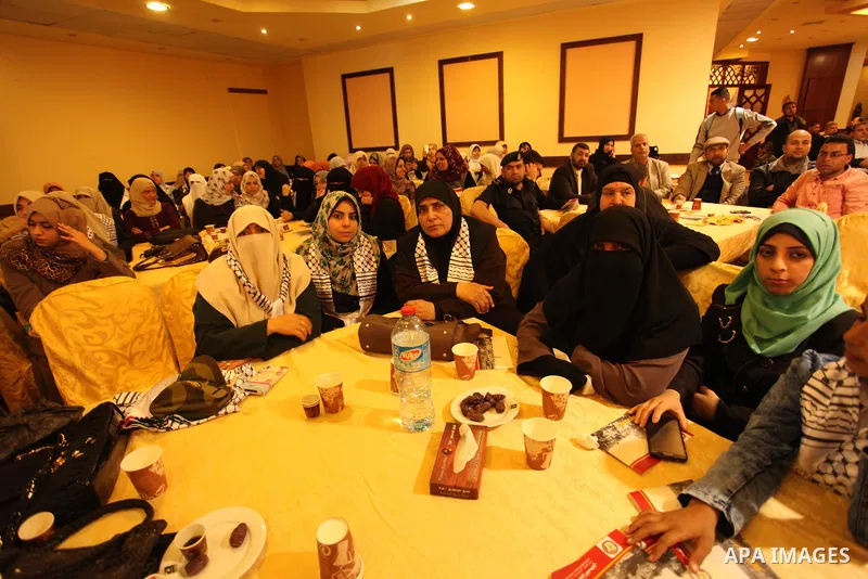 Palestinians attend a ceremony Book sinning for Hamas founder the martyr, Ahmed Yaseen in 12th anniversary for his assassination in Gaza City on March 22, 2016. Photo by Ashraf Amra