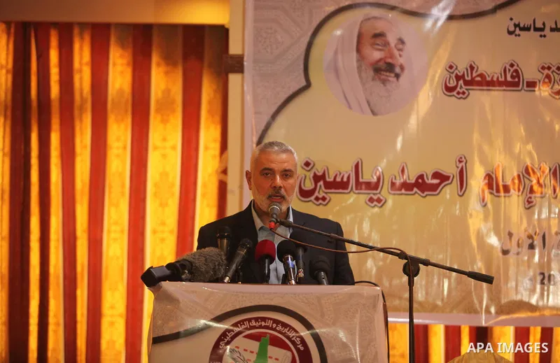 Senior Hamas leader Ismail Haniya attends a ceremony Book sinning for Hamas founder the martyr, Ahmed Yaseen in 12th anniversary for his assassination in Gaza City on March 22, 2016. Photo by Ashraf Amra