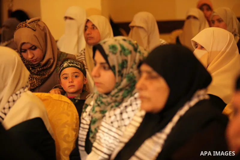 Palestinians attend a ceremony Book sinning for Hamas founder the martyr, Ahmed Yaseen in 12th anniversary for his assassination in Gaza City on March 22, 2016. Photo by Ashraf Amra