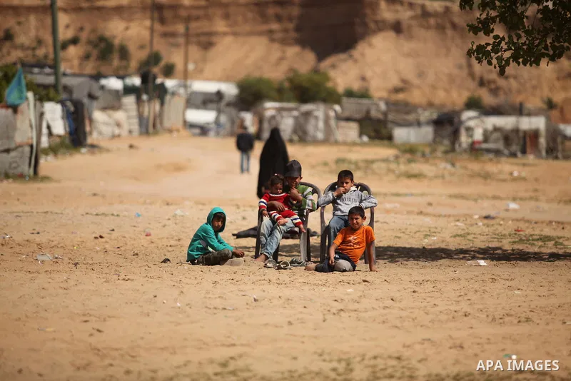 Palestinian children paly in Beit Lahia in the northern Gaza Strip, on March 22, 2016. Photo by Ashraf Amra