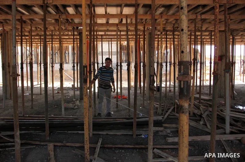 Palestinian construction labourers work on a Turkish funded project to build 320 housing units for families who lost their homes during the 50-day war between Israel and Hamas-led militants in the summer of 2014, east of...